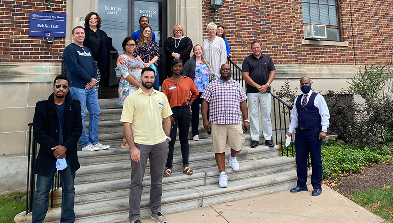 The University of New Haven’s inaugural Doctor of Health Sciences cohort on the steps of Echlin Hall.