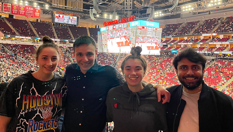 Group image of, left to right: Left to right: Keira Integlia, Andreas Xenofontos, Josie Schmidt, and Mohammed Anas Ali at a Houston Rockets game.